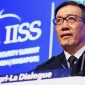 Ilustrasi gambar Laksamana Dong Jun menyampaikan pidato dalam dialog IISS Shangri-La ke-21