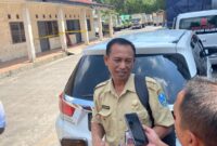 Pengawas Tenaga Kerja Disnaker Provinsi saat diwawancarai (Sumber foto: Sigit)