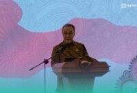 Anggota Dewan Komisioner Otoritas Jasa Keuangan (OJK) RI, Dicky Kartikoyono, saat sambutan di acara pengukuhan kepala OJK Jember (Foto: Fadli/Frensia). 