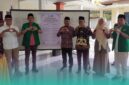 Pimpinan Cabang (PC) Gerakan Pemuda (GP) Ansor Kencong, bersama narasumber saat meluncurkan Kampung Moderasi Beragama (KMB), di Desa Sukoreno, Kecamatan Umbulsari, Jember. (Foto: Ansor Kencong). 