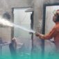Petugas pemadam kebakaran (Damkar) Jember, saat memadamkan api di sela-sela keramik rumah yang terbakar. (Foto: Istimewa). 