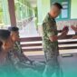 Anggota TNI Kodim 0824 Jember, saat dilayani transaksi oleh karyawan Bank BRI Jember. (Foto: Istimewa). 
